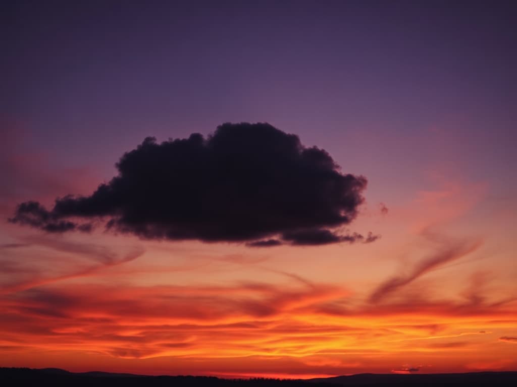 A single dramatic cloud formation lit from underneath, tangerine climbing into rust, over a low silhouetted treeline.